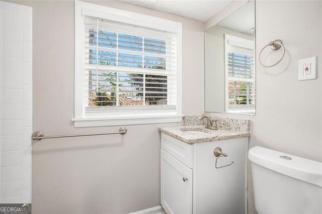 bathroom with vanity and toilet