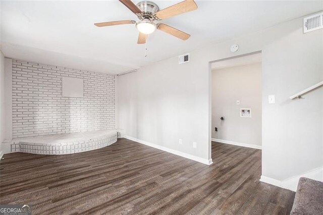 unfurnished room with ceiling fan and dark hardwood / wood-style floors