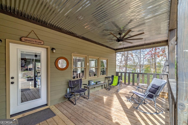 deck with covered porch and ceiling fan