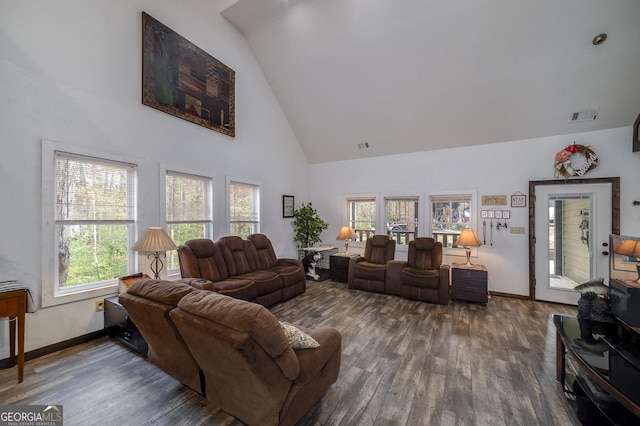 living room featuring a wealth of natural light, high vaulted ceiling, and dark wood-type flooring