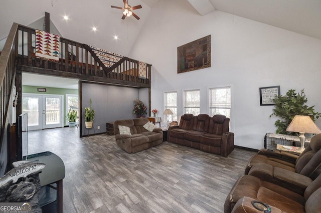 living room with hardwood / wood-style flooring, ceiling fan, high vaulted ceiling, and french doors