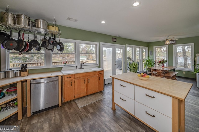 kitchen with plenty of natural light, refrigerator, dark hardwood / wood-style flooring, and french doors