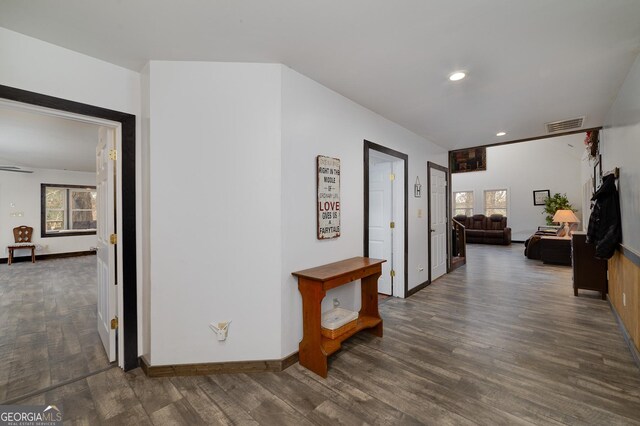 hallway with dark hardwood / wood-style flooring