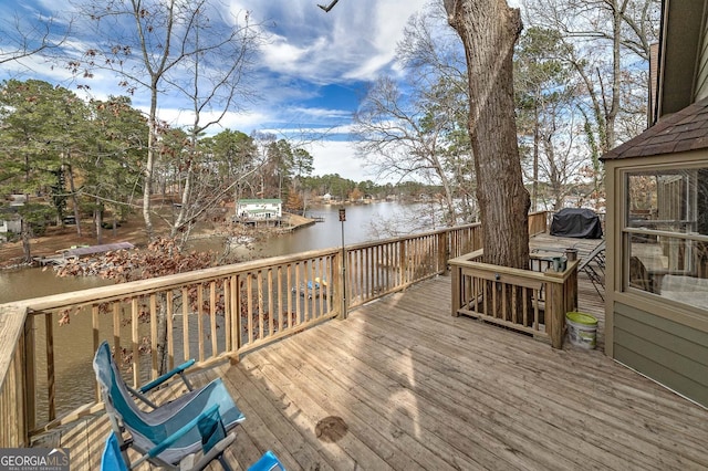 wooden terrace with a water view