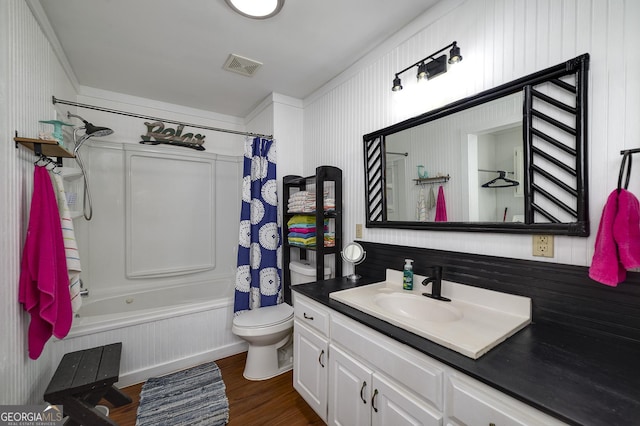 full bathroom featuring wood-type flooring, vanity, toilet, and shower / bathtub combination with curtain