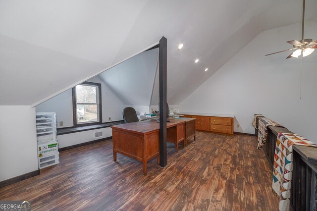 home office with ceiling fan, dark hardwood / wood-style flooring, and vaulted ceiling