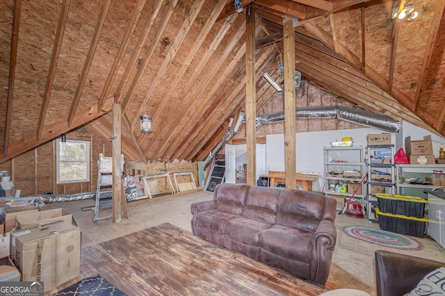 living room featuring lofted ceiling