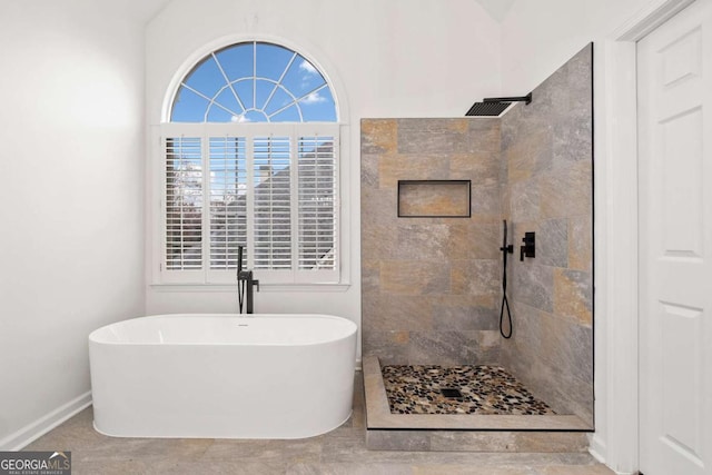 bathroom with tile patterned floors and plus walk in shower