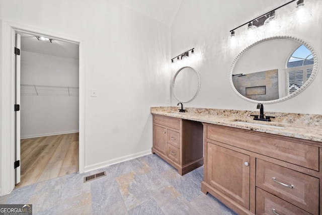 bathroom with vanity and hardwood / wood-style flooring