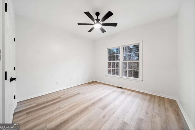 spare room featuring ceiling fan and light hardwood / wood-style flooring