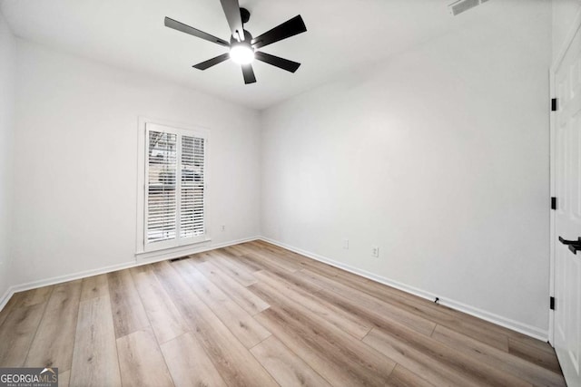 unfurnished room featuring light hardwood / wood-style floors and ceiling fan