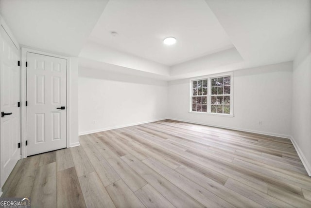 spare room with light hardwood / wood-style flooring