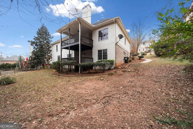 rear view of property with a balcony