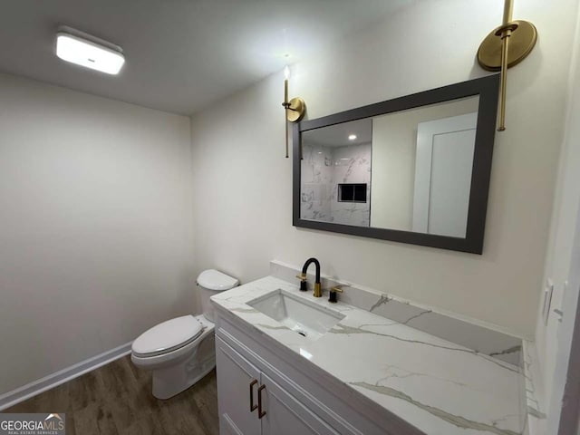 bathroom featuring hardwood / wood-style floors, vanity, and toilet