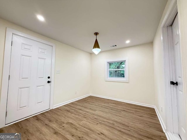 spare room featuring hardwood / wood-style flooring