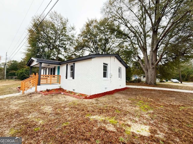 view of property exterior with covered porch