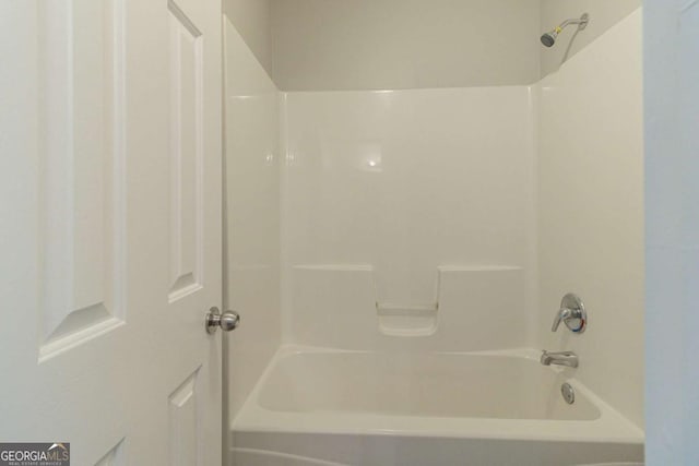 bathroom with washtub / shower combination