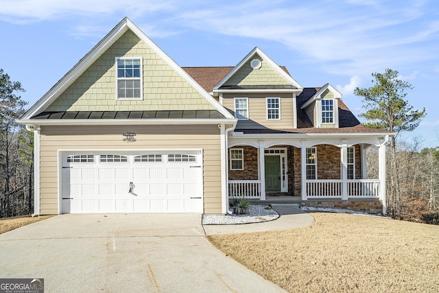 view of front of property featuring covered porch and a garage