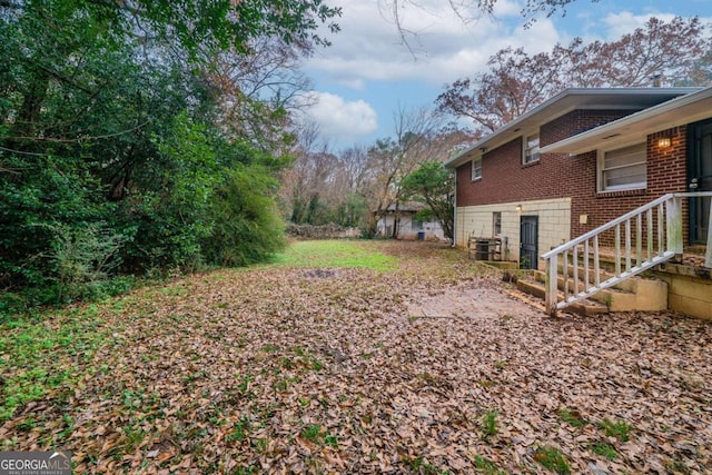 view of yard featuring central AC