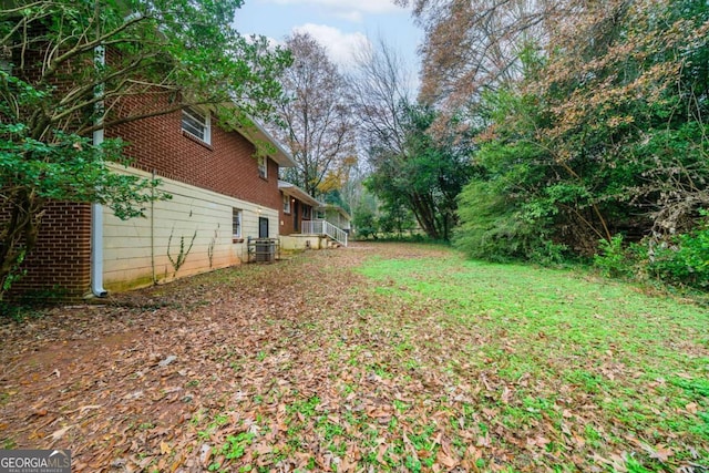 view of yard featuring central AC