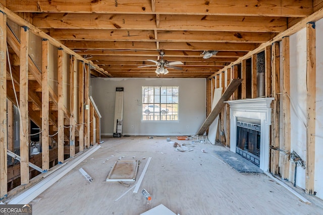 interior space with ceiling fan