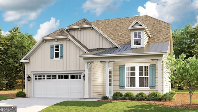 view of front of home with a front yard and a garage