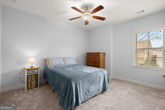 carpeted bedroom featuring ceiling fan