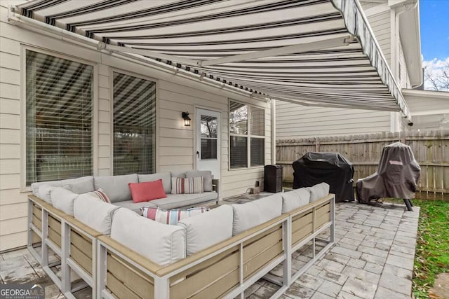 view of patio with an outdoor hangout area and grilling area