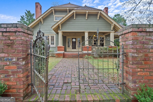 back of property featuring a porch