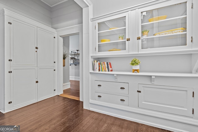 hallway with dark hardwood / wood-style floors