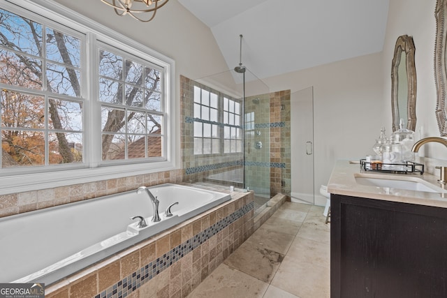 bathroom featuring plus walk in shower, vanity, lofted ceiling, and a notable chandelier