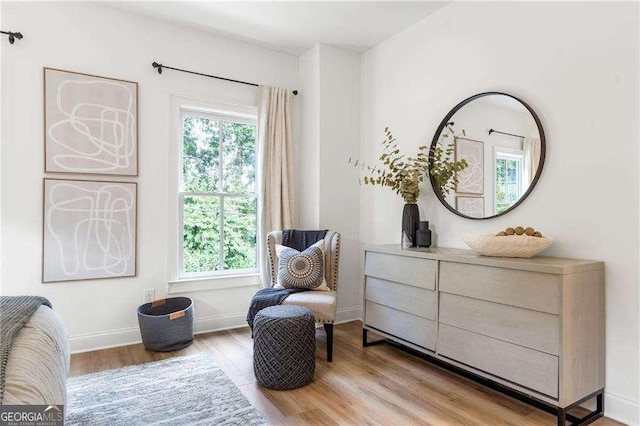 living area with light hardwood / wood-style floors