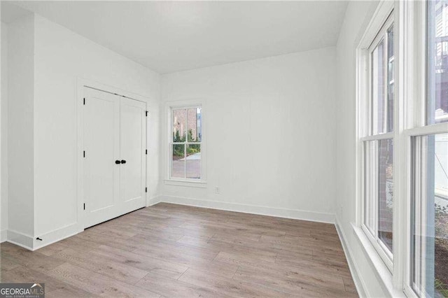 unfurnished room featuring light hardwood / wood-style flooring