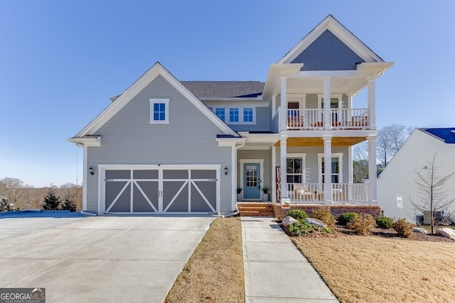 view of front of home featuring covered porch and a garage