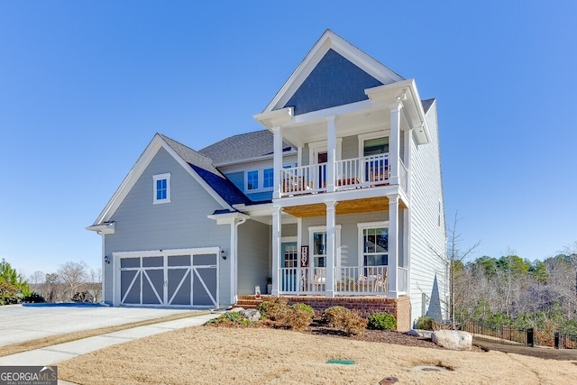 view of front of home featuring a porch and a garage