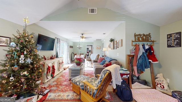 living room featuring ceiling fan and vaulted ceiling