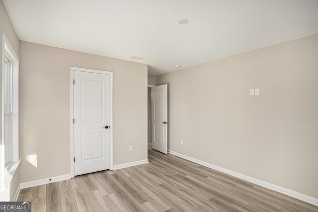 unfurnished bedroom featuring light hardwood / wood-style flooring