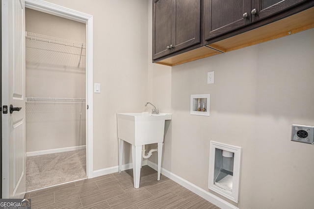 clothes washing area featuring light carpet, hookup for a washing machine, cabinets, and hookup for an electric dryer