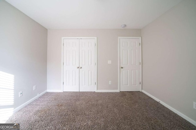 unfurnished bedroom featuring carpet floors