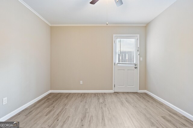 spare room featuring ceiling fan, light hardwood / wood-style floors, and crown molding