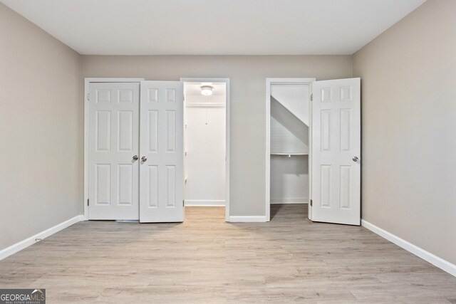 unfurnished bedroom with light hardwood / wood-style floors