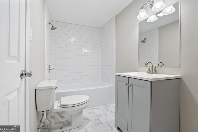 full bathroom featuring vanity, toilet, and tiled shower / bath combo