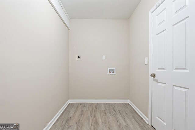 washroom featuring hookup for an electric dryer, hookup for a washing machine, and light hardwood / wood-style flooring