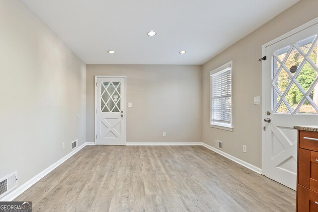 entryway with light hardwood / wood-style floors