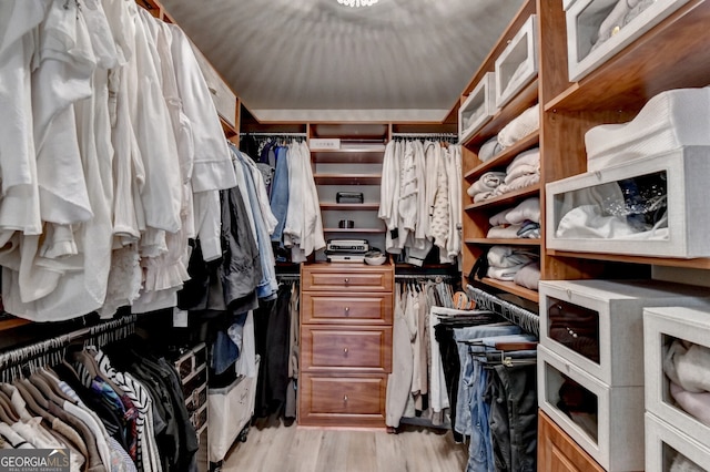 walk in closet featuring light wood-type flooring