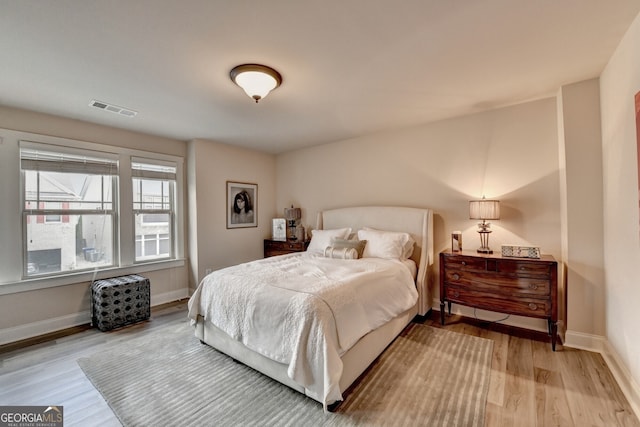 bedroom with hardwood / wood-style floors