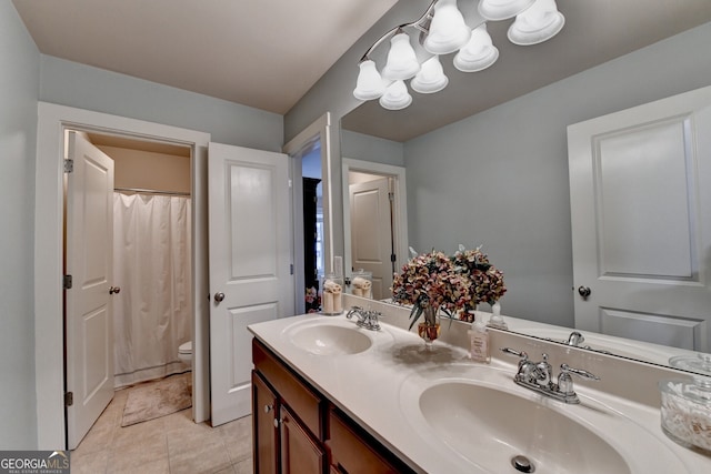 bathroom with tile patterned floors, vanity, toilet, and a shower with shower curtain