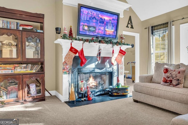 interior space with carpet flooring and vaulted ceiling