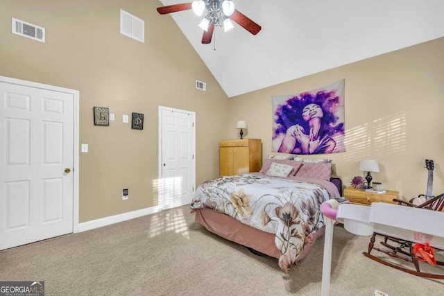 carpeted bedroom featuring ceiling fan and high vaulted ceiling