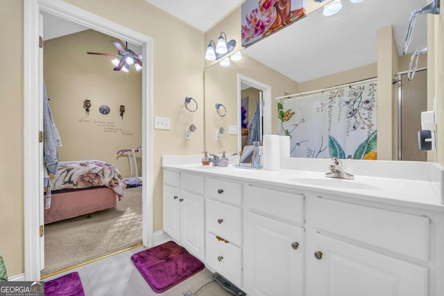 bathroom with a shower with curtain, ceiling fan, and vanity